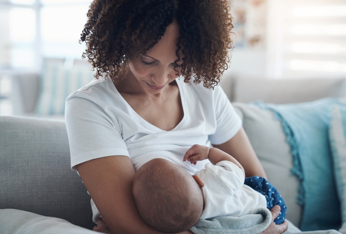 mother breastfeeds her child